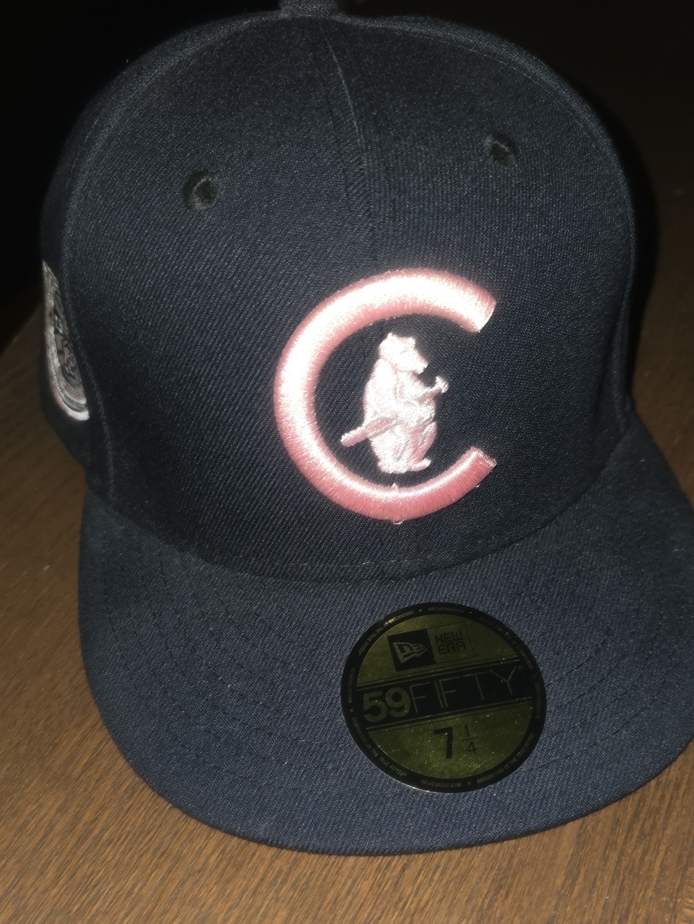 New Era 59FIFTY fitted Chicago Cubs hat features a prominent pink-outlined bear